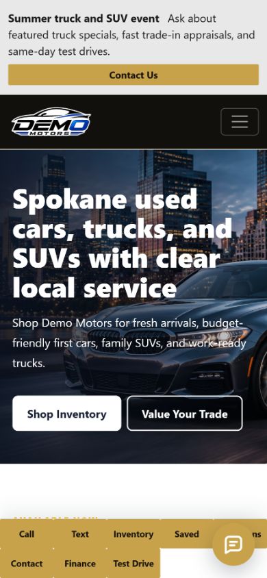 Demo Motors dealer website shown on a phone